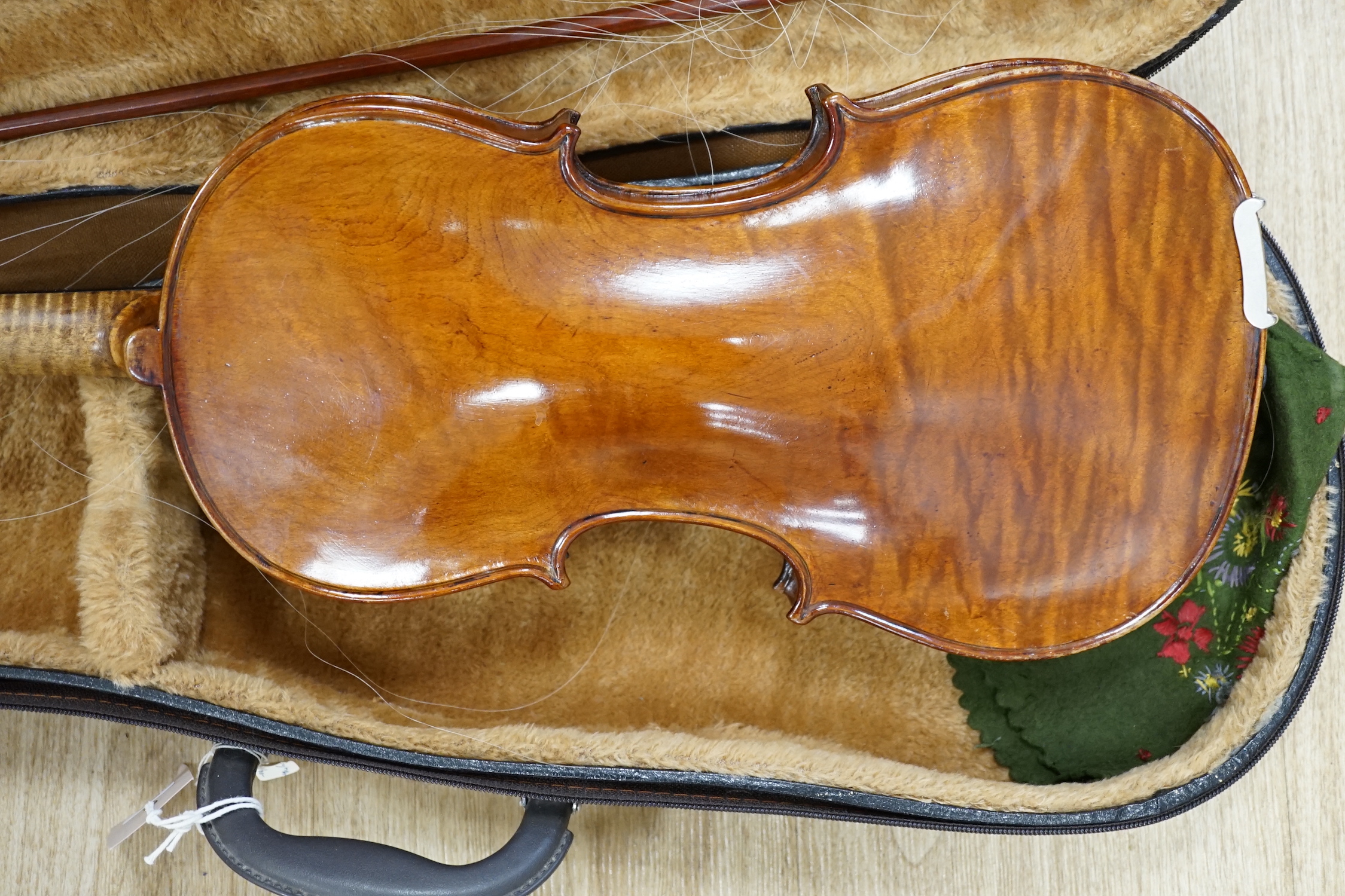 A cased 19th century German violin with paper label for August Hensel, length of body, 36cm, with two bows, CITES submission references, FBHZDSA1 and ZCXXMHV4